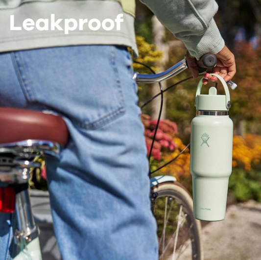 Hydro Flask 32oz Nectar Orange leakproof water bottle on bicycle
