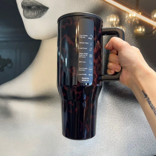HydroJug 40oz black marble insulated tumbler lifestyle view