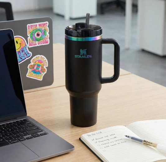 Stanley black rainbow rim tumbler with straw on desk