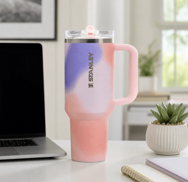 Stanley 40oz pink purple gradient tumbler on desk