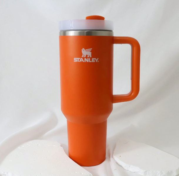 Stanley 40oz matte orange insulated tumbler with handle and lid